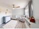 Cozy Bedroom featuring a crib, soft rug, plush chair, and stylish decor at 13710 Westshire Dr, Tampa, FL 33618