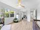 Bright bedroom with laminate floors, ceiling fan and mirrored closet at 13710 Westshire Dr, Tampa, FL 33618