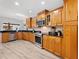 Modern kitchen with stainless steel appliances, granite countertops, and custom wood cabinetry at 13710 Westshire Dr, Tampa, FL 33618