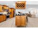 Bright open kitchen and dining area with views, stainless steel appliances, and custom cabinetry at 13710 Westshire Dr, Tampa, FL 33618