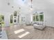 Bright living room with skylights, vaulted ceiling and large windows at 13710 Westshire Dr, Tampa, FL 33618