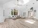 Spacious living room with hardwood floors and natural lighting at 13710 Westshire Dr, Tampa, FL 33618