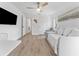 Well-lit living room with hardwood floors, and a comfy daybed great for relaxing at 13710 Westshire Dr, Tampa, FL 33618