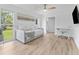 Inviting living space featuring stylish laminate floors and lots of natural light at 13710 Westshire Dr, Tampa, FL 33618