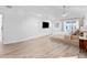 Bright main bedroom featuring wood floors and a ceiling fan at 13710 Westshire Dr, Tampa, FL 33618