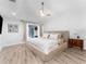 Main bedroom with wood floors, ceiling fan and outdoor access at 13710 Westshire Dr, Tampa, FL 33618