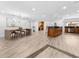 Spacious open floor plan featuring hardwood floors, large island, and a seamless flow to dining area at 13710 Westshire Dr, Tampa, FL 33618