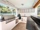 Entertain in this outdoor kitchen, complete with built-in grill, granite countertop, and plenty of storage at 13710 Westshire Dr, Tampa, FL 33618