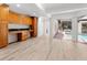 Open floor plan with view of the pool and outdoor space, and custom built-in desk at 13710 Westshire Dr, Tampa, FL 33618