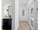 Stylish powder room featuring modern vanity and fixtures adjacent to the hallway leading to pool area at 13710 Westshire Dr, Tampa, FL 33618