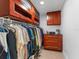 Cherry wood cabinet doors adorn the storage unit, with ample space to arrange any personal items at 13710 Westshire Dr, Tampa, FL 33618