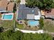 Aerial view showcasing a home with a pool, patio, and well-maintained backyard at 14030 79Th Ave, Seminole, FL 33776