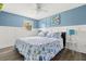 Bright bedroom featuring nautical themed decor, stylish coastal accents, and a ceiling fan at 14030 79Th Ave, Seminole, FL 33776