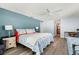 Bright bedroom featuring light blue walls and ensuite bathroom with views of the outdoors at 14030 79Th Ave, Seminole, FL 33776