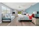 Bright bedroom with ensuite, light blue walls, and sliding door access to the pool area at 14030 79Th Ave, Seminole, FL 33776