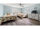 Comfortable guest bedroom with two beds, dresser, coastal decor, and lots of natural light at 14030 79Th Ave, Seminole, FL 33776