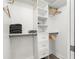 Organized walk-in closet featuring shelves and drawers for optimal storage at 14030 79Th Ave, Seminole, FL 33776