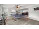 Spacious game room with ping pong table and access to the living room at 14030 79Th Ave, Seminole, FL 33776
