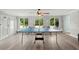 Bright game room featuring a ping pong table, and natural light at 14030 79Th Ave, Seminole, FL 33776
