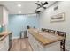 Bright eat-in kitchen featuring white cabinets, granite countertops, and modern stainless steel appliances at 14030 79Th Ave, Seminole, FL 33776