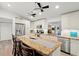 Spacious kitchen featuring white cabinets, granite countertops, and modern stainless steel appliances at 14030 79Th Ave, Seminole, FL 33776
