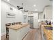 Bright kitchen featuring stainless steel appliances, granite countertops, and a breakfast bar at 14030 79Th Ave, Seminole, FL 33776