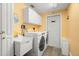 Bright laundry room featuring washer, dryer, sink, and folding space at 14030 79Th Ave, Seminole, FL 33776
