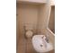 Well-maintained powder room with a toilet, sink, and mirror at 14442 Reuter Strasse Cir # 812, Tampa, FL 33613