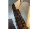 Carpeted staircase with dark wood railing, offering a path to the upper level at 14442 Reuter Strasse Cir # 812, Tampa, FL 33613