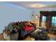 Cozy living room features a comfortable couch with decorative pillows and a vintage-style lamp at 1448 Temple St, Clearwater, FL 33756