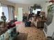Comfortable living room with tiled floor, a sofa, and a view to the outside at 1448 Temple St, Clearwater, FL 33756