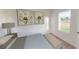 Cozy bedroom with natural light from a window, complemented by simple decor and comfortable furnishings at 14710 Italy Ave, Dade City, FL 33523