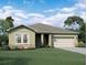 Charming single-story home featuring a two-car garage, stone accents, and a well-manicured lawn at 14710 Italy Ave, Dade City, FL 33523