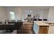 Bright and airy living space with an open layout, seamlessly connecting the kitchen, dining, and living areas at 14710 Italy Ave, Dade City, FL 33523
