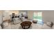 Spacious living room with neutral decor, plush seating, and sliding glass doors leading to the outdoors at 14710 Italy Ave, Dade City, FL 33523