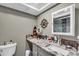Updated bathroom featuring granite countertops, gray cabinets, and stylish decor at 1485 Lakeview Rd # 2, Clearwater, FL 33756