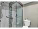 Beautiful updated bathroom features a glass-enclosed shower with decorative tile and accessibility grab bars at 1485 Lakeview Rd # 2, Clearwater, FL 33756