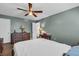 This bedroom provides a serene space with its calming color scheme and ceiling fan at 1485 Lakeview Rd # 2, Clearwater, FL 33756