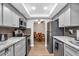 Remodeled kitchen with stainless steel appliances, granite counters, and updated cabinets at 1485 Lakeview Rd # 2, Clearwater, FL 33756