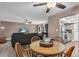 Open floor plan featuring a living room and dining area with hardwood floors and comfortable seating at 1485 Lakeview Rd # 2, Clearwater, FL 33756