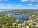 Stunning aerial view of waterfront homes nestled among lush trees and serene water features at 1531 75Th Ne Cir, St Petersburg, FL 33702
