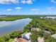 Breathtaking aerial view of homes along a waterway, lush greenery, and serene waters at 1531 75Th Ne Cir, St Petersburg, FL 33702