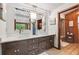 Bathroom with a double sink, vanity, and a walk-in shower at 1531 75Th Ne Cir, St Petersburg, FL 33702