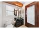 Bathroom with a dark vanity and a glass bowl sink at 1531 75Th Ne Cir, St Petersburg, FL 33702