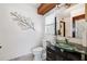 Bathroom with decorative art and a glass bowl sink at 1531 75Th Ne Cir, St Petersburg, FL 33702