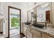 Bathroom features dual vessel sinks, granite countertop, and natural light at 1531 75Th Ne Cir, St Petersburg, FL 33702