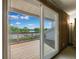 Wooden deck with a view of trees and lake at 1531 75Th Ne Cir, St Petersburg, FL 33702