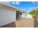 Wooden deck with sliding glass doors and a view of the backyard at 1531 75Th Ne Cir, St Petersburg, FL 33702