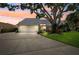 Well-maintained home with a gray metal roof, two-car garage and mature landscaping at 1531 75Th Ne Cir, St Petersburg, FL 33702