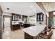 Well-equipped kitchen with dark wood cabinets, stainless steel appliances, and a breakfast bar seating area at 1531 75Th Ne Cir, St Petersburg, FL 33702